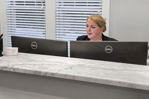 Woman looking at monitors